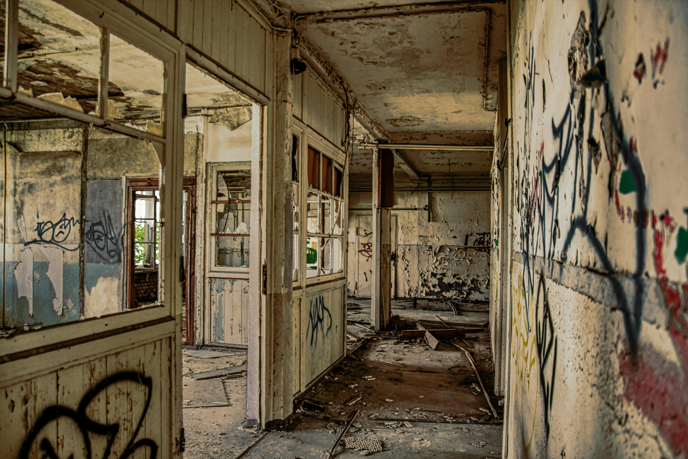 a run down building with graffiti on the wall