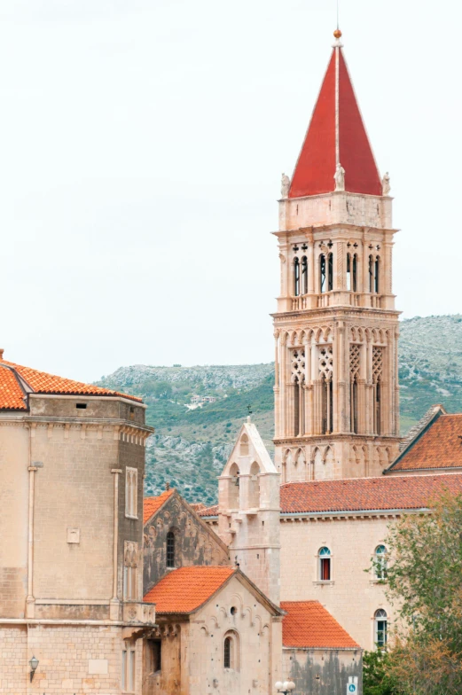 the old city has a church steeple with a red dome