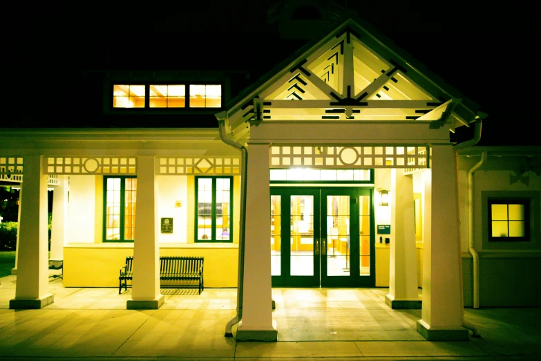 an outside building that is lit up with lights