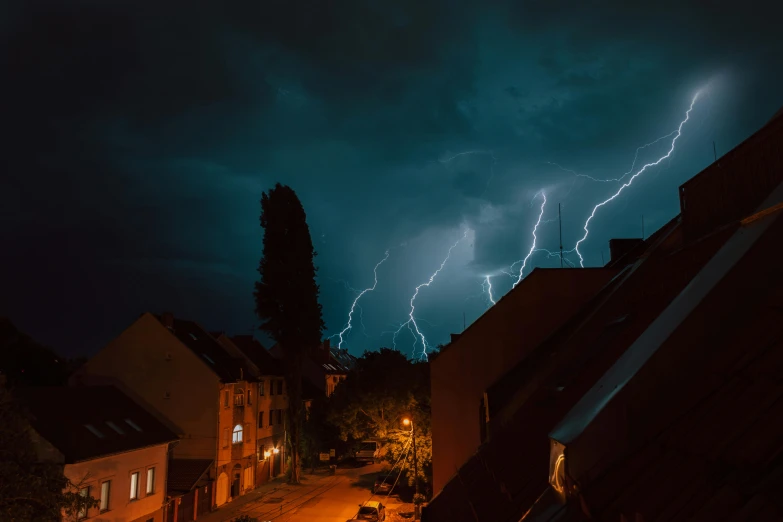 several lightning strikes on a night sky in the city