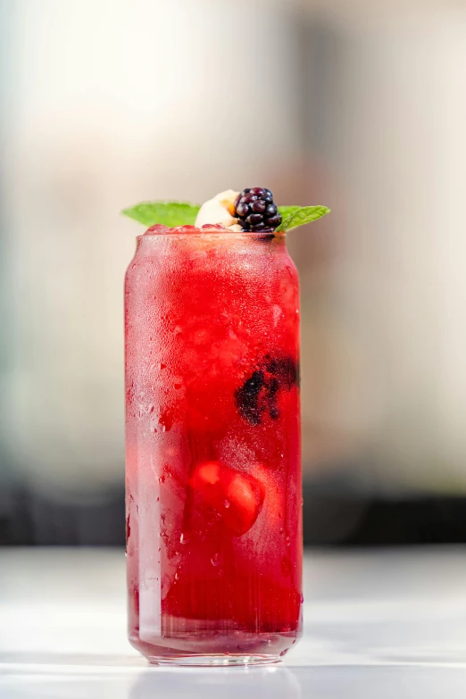 a close up of a drink in a glass with ice