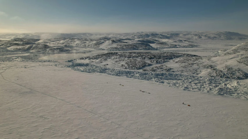 a po taken from an airplane looking down at snowy mountains