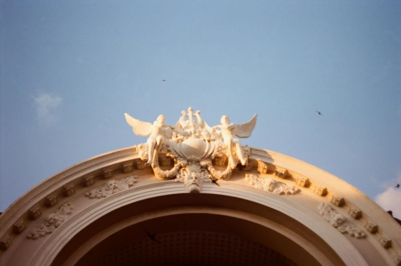 a close up of the base of a building with a clock