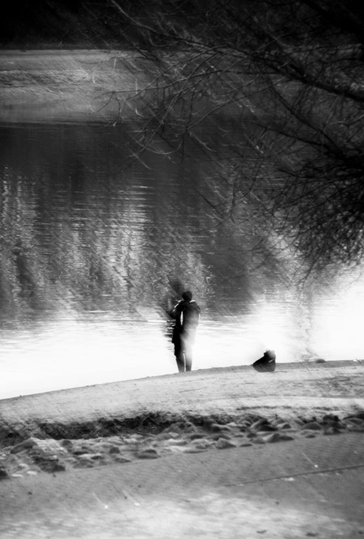 a person walking on a river, with snow on the ground