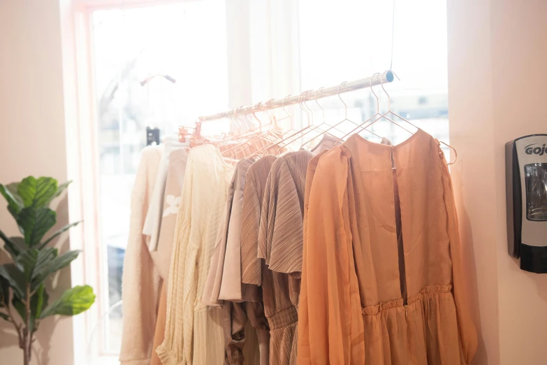 various items hanging on rack in front of a window