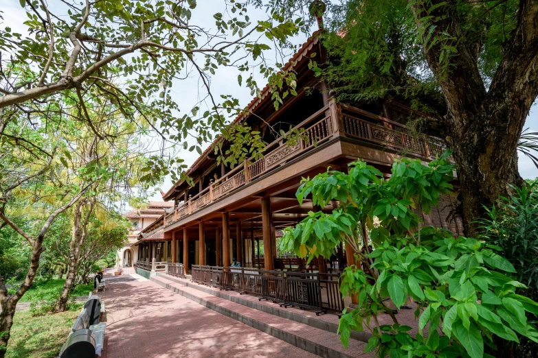 a long building surrounded by trees and foliage