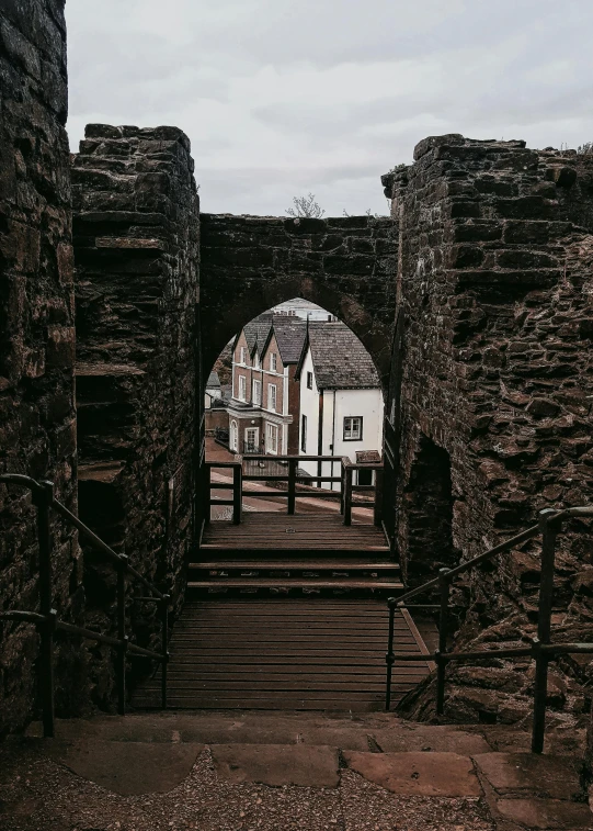 the arches in the castle have been built over some buildings