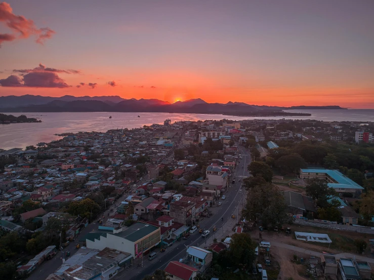 sunset over an overview with a village in the foreground