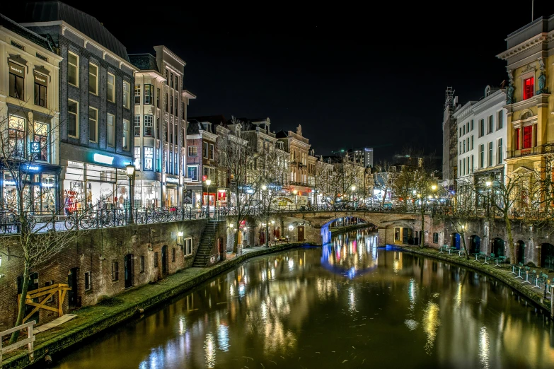 lights reflecting in the river in a city