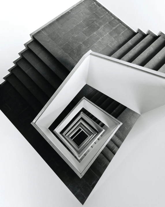 looking up at an abstract architecture structure with various pieces of dark black cloth