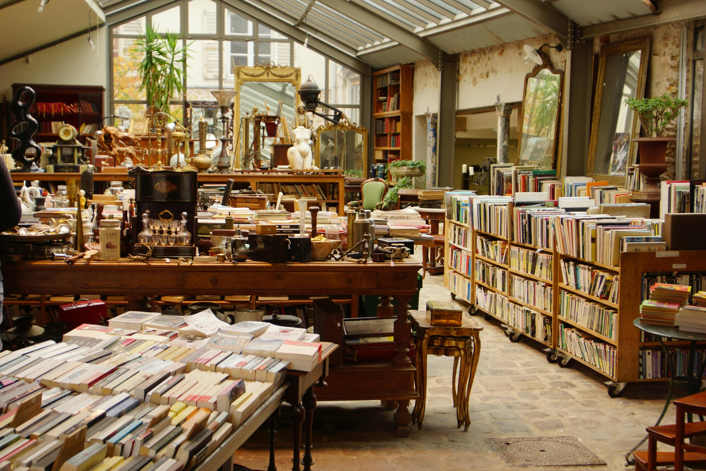 large room full of books with a skylight overhead