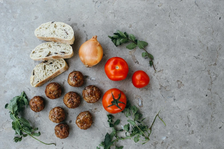 several different kinds of vegetables are on a cement surface