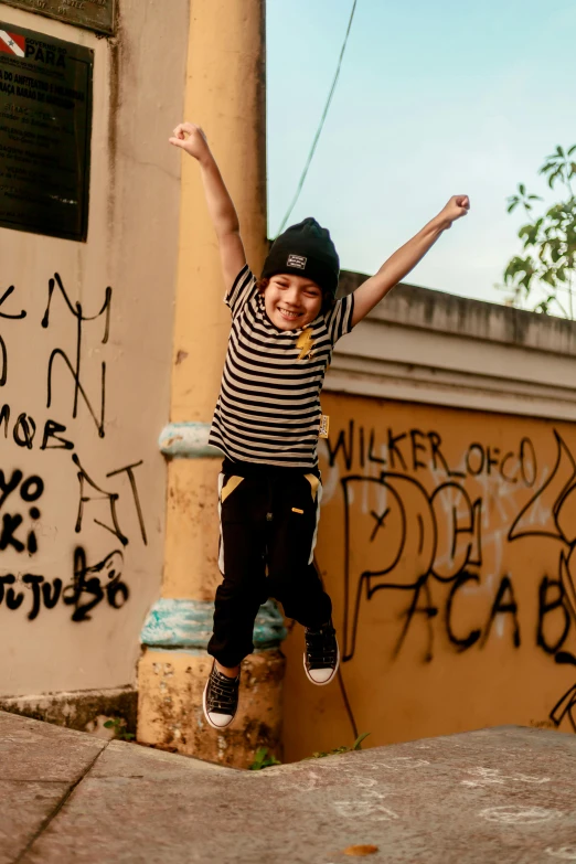 a  riding on top of a skateboard