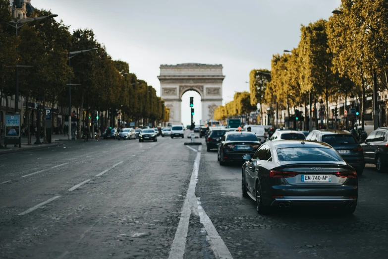 several cars are parked along the side of a road