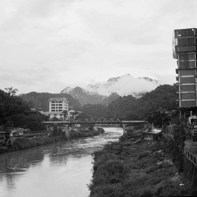 a view of a river flowing by several buildings