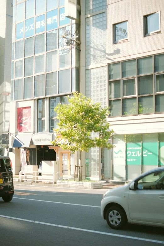 a view of some tall buildings from the street