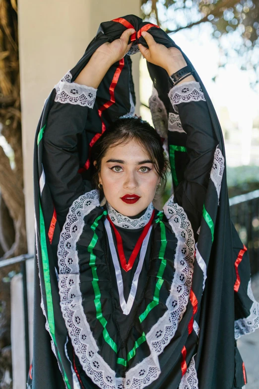 woman dressed up with jewelry on her head