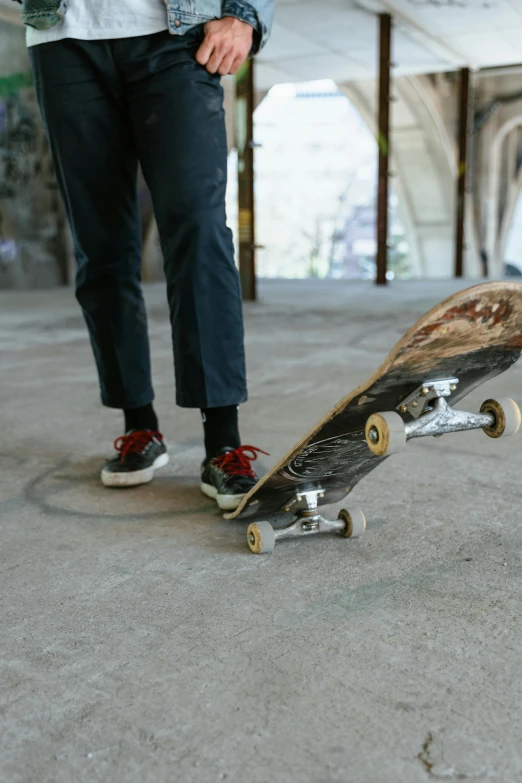 a skateboard with someone's feet propped up on it