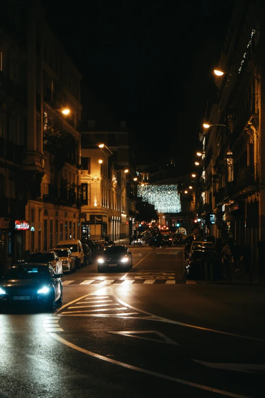 a group of cars on the street at night