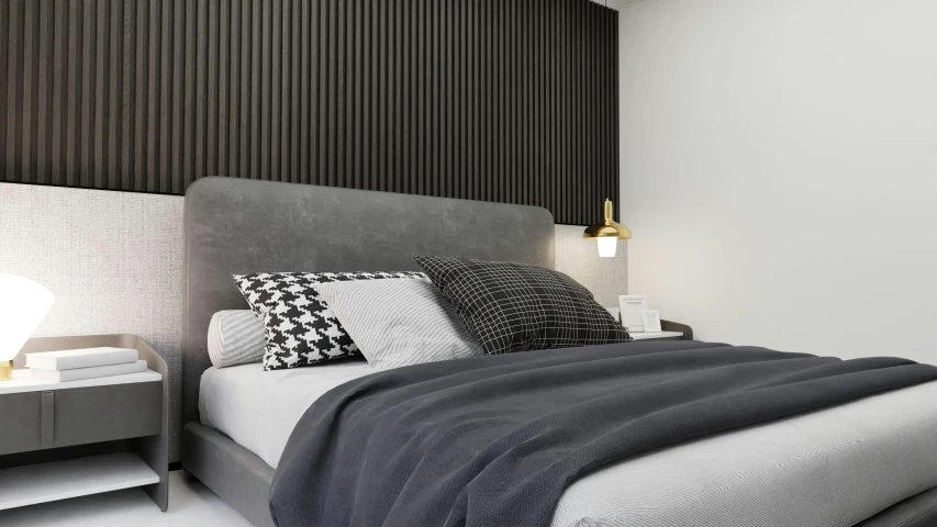 an unmade bed with a gray headboard and two nightstands