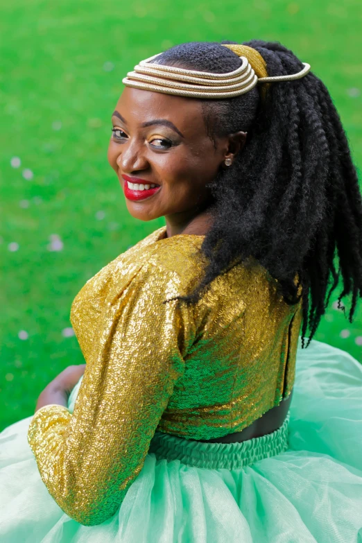 a woman with an afro is sitting on the ground