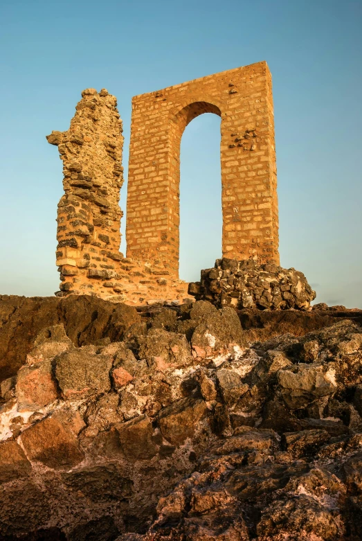 two stone pillars, one in the middle, and one in the ground