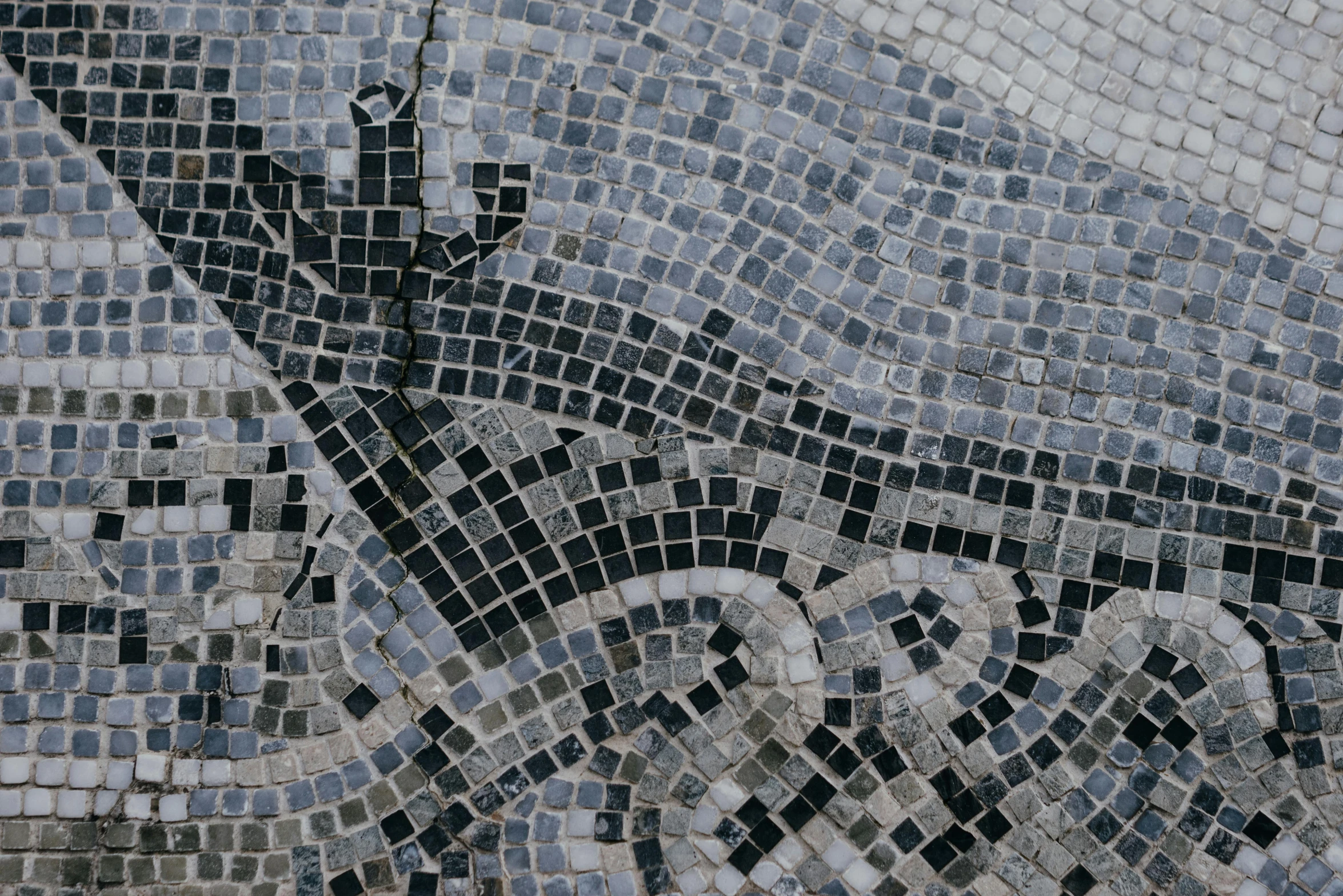 a mosaic tile is shown with a building on the bottom