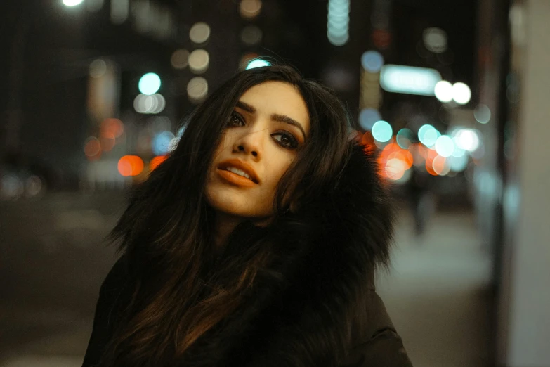 the woman is standing in the dark by her car