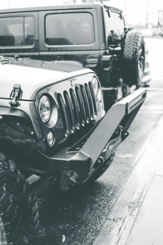 a jeep being towed on the side of a road