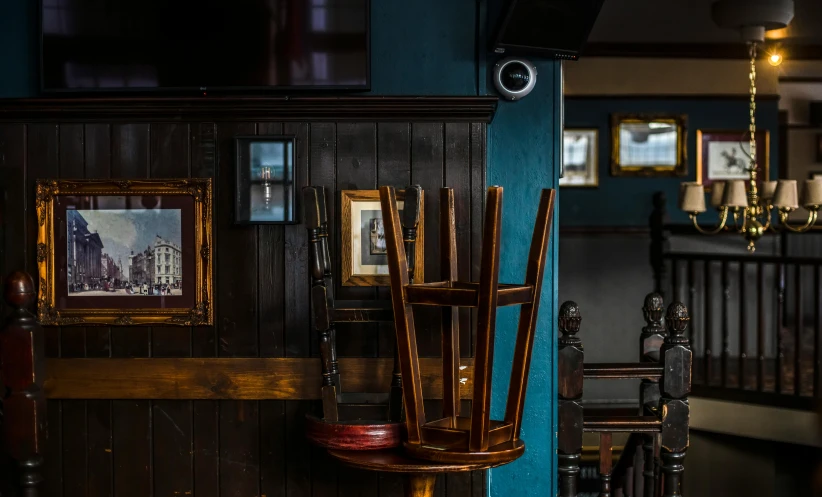 chairs that are next to each other with pictures on the walls