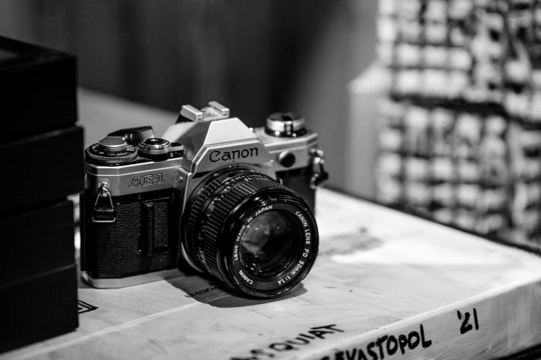 a camera sitting on top of a box next to a box