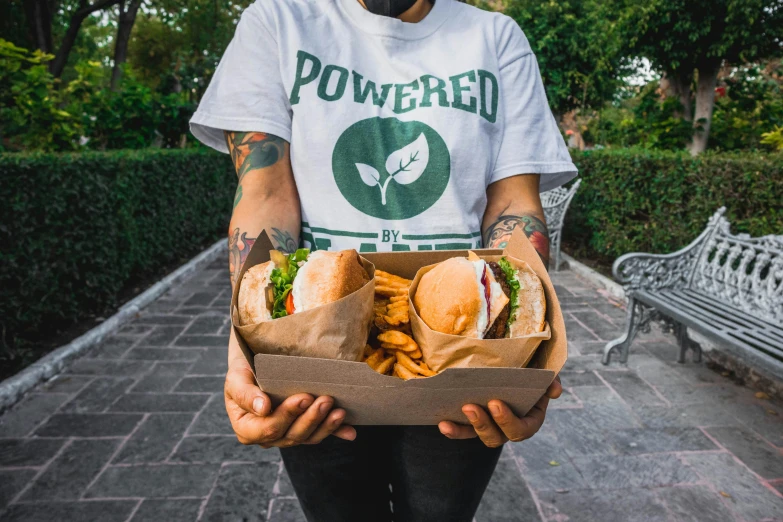 a man holding some kind of bag full of food