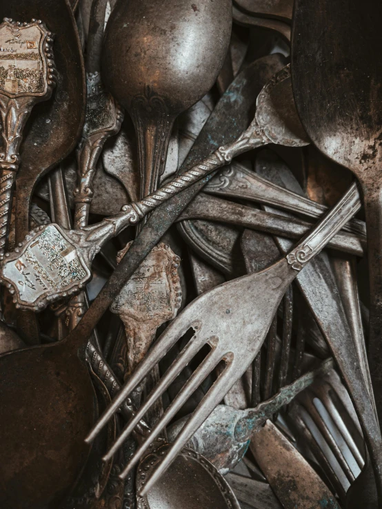 there are many spoons and forks that are very old