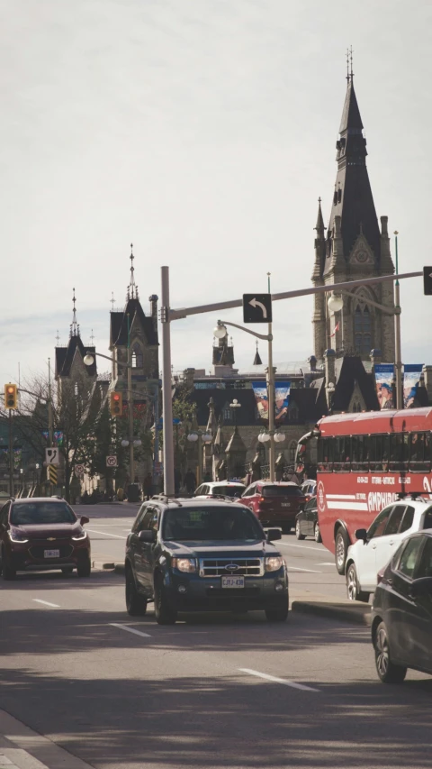 there are two vehicles that are passing by the traffic light