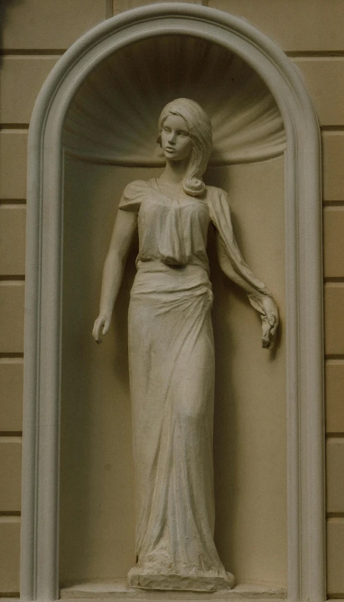 a statue that is on the side of a building