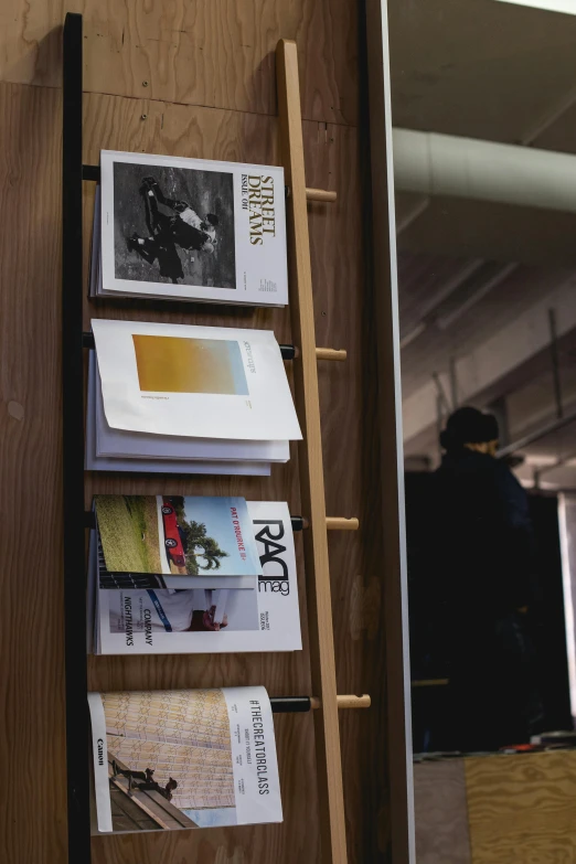 a wooden ladder next to books about writing