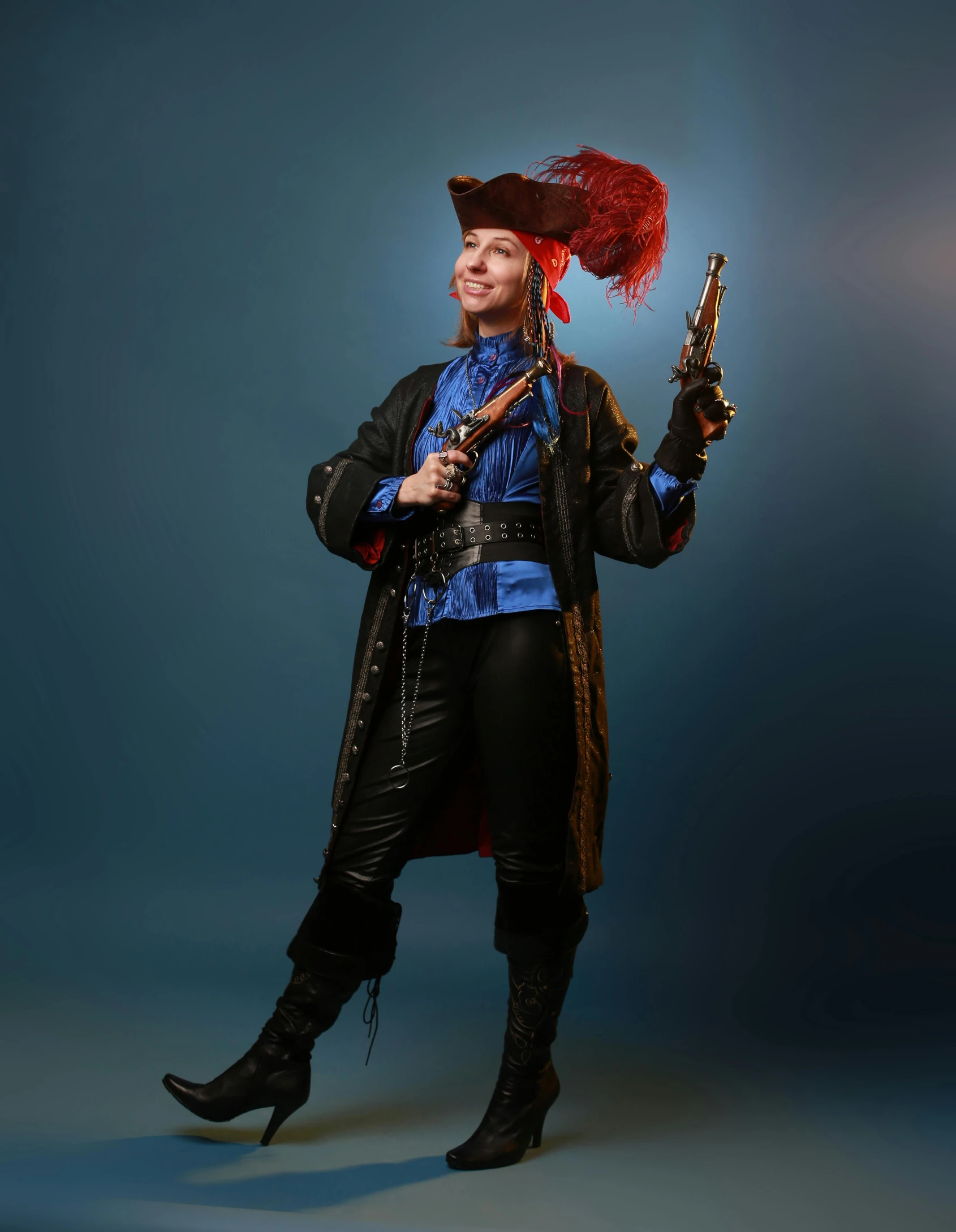 a man dressed as a pirate holding a gun