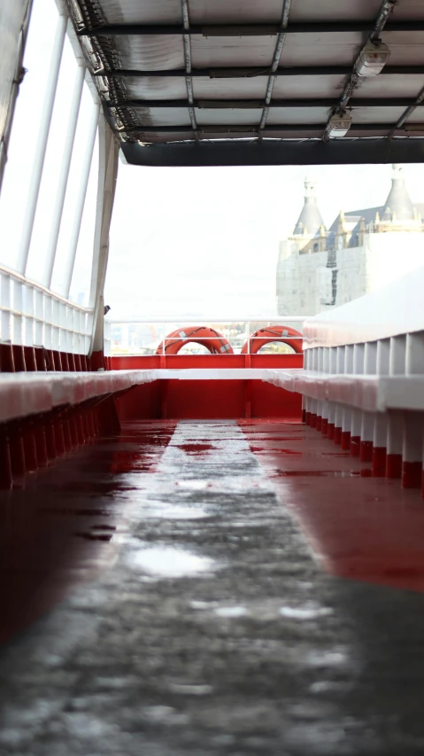 two bridges on the water, one being red and the other is white