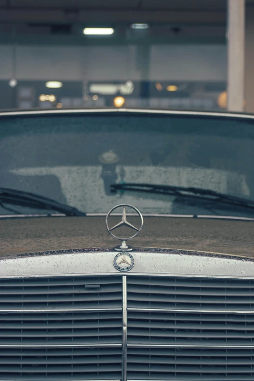 a closeup of the hood and grille of a mercedes benz car