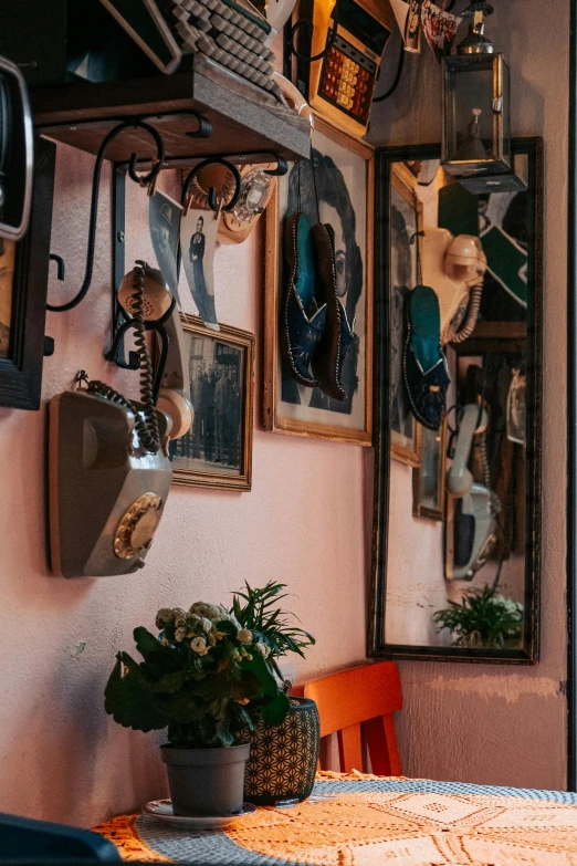 a table with three different wall hangings on it