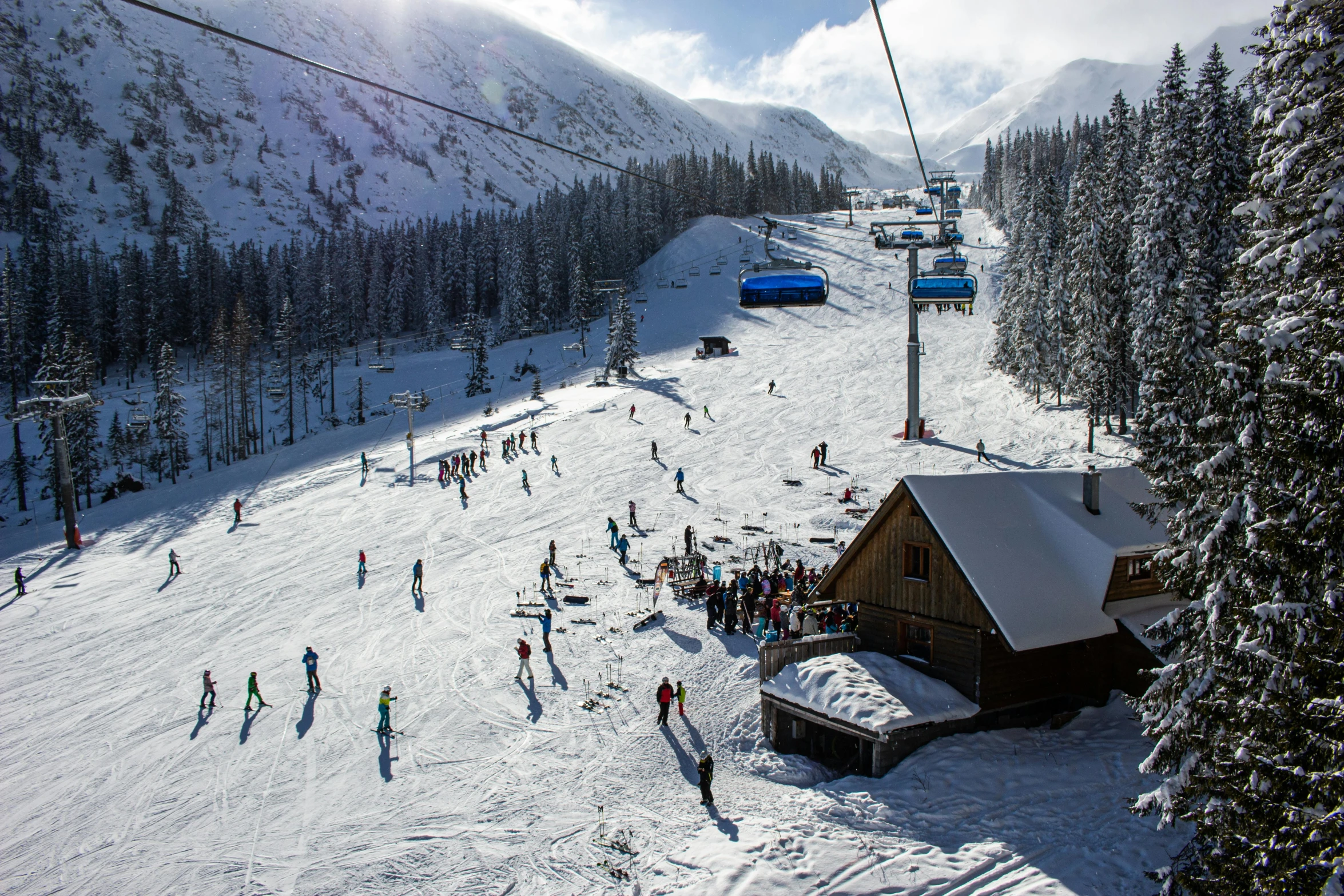 skiers gather to head up the snowy mountain