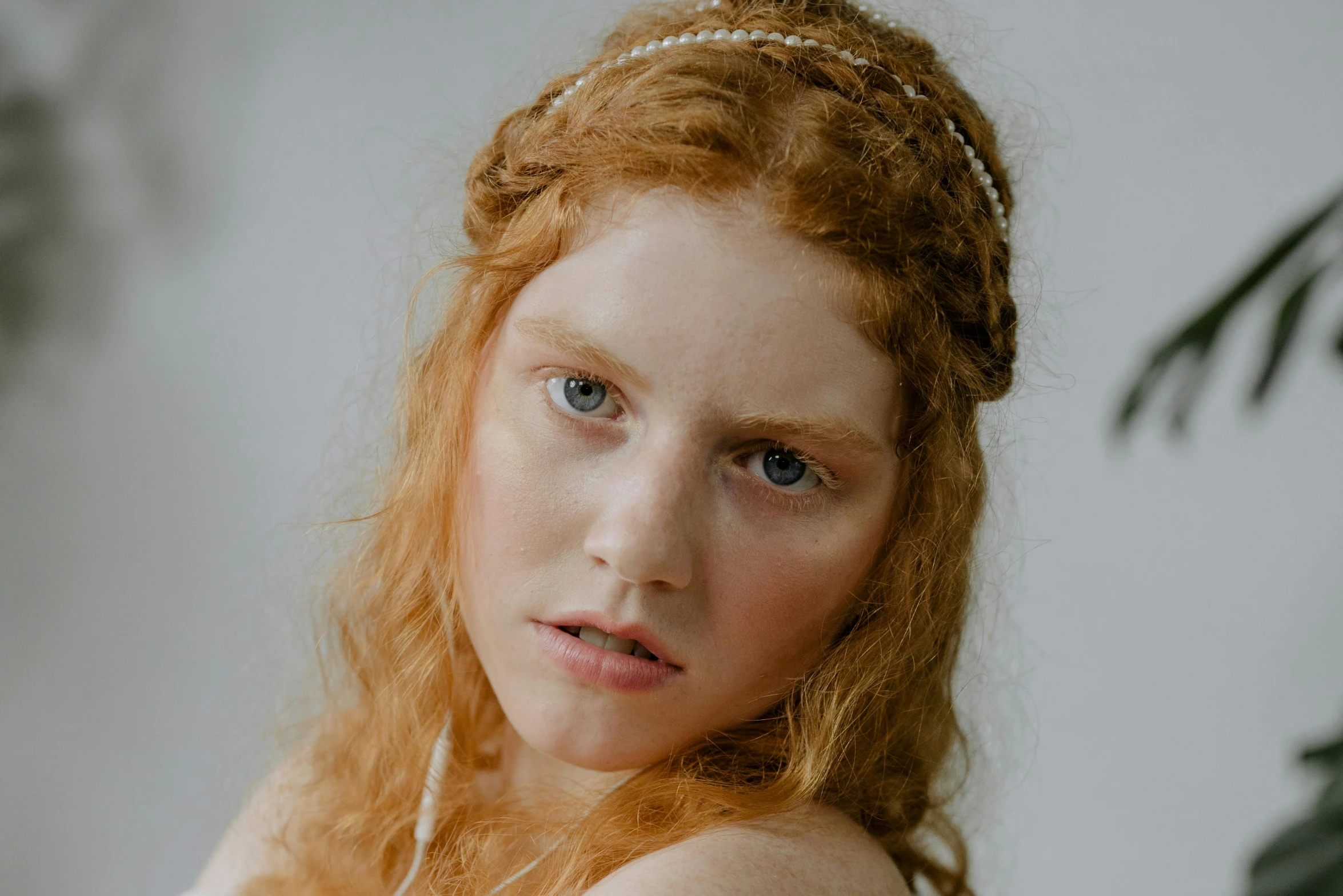 a woman with ginger hair in an alluring image