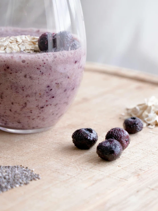 a glass full of berries, oatmeal and cereal