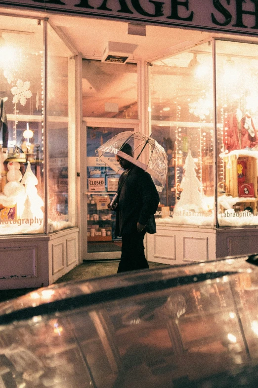 the woman is standing outside of the store