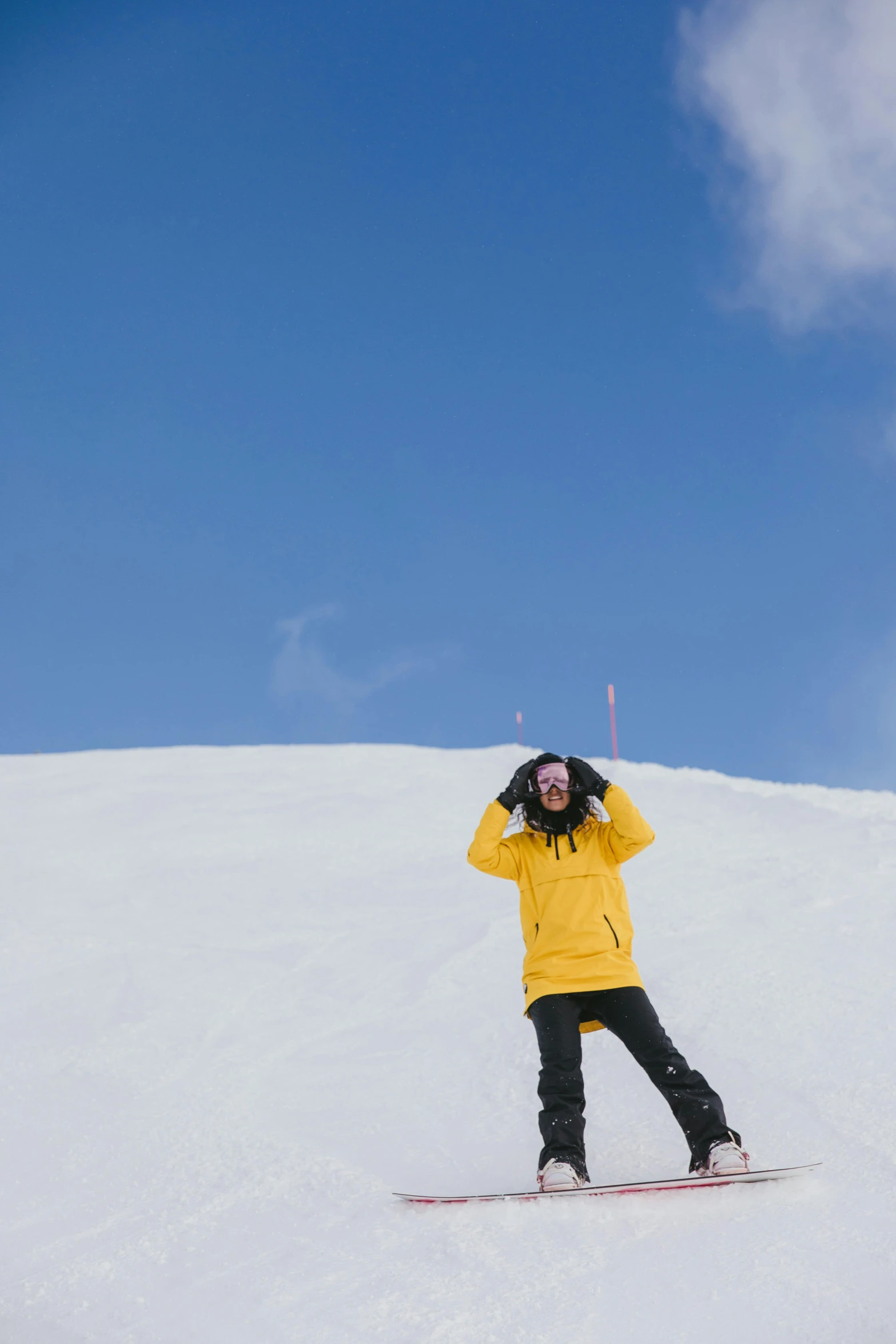 a man riding skis down the side of a snow covered slope