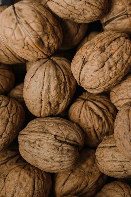 there are nuts stacked up together in a pile