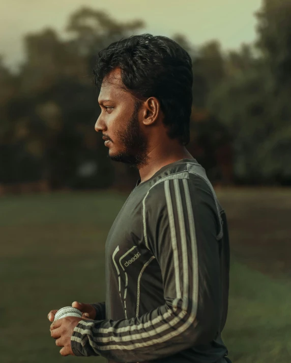 a man holding a soccer ball in his hands