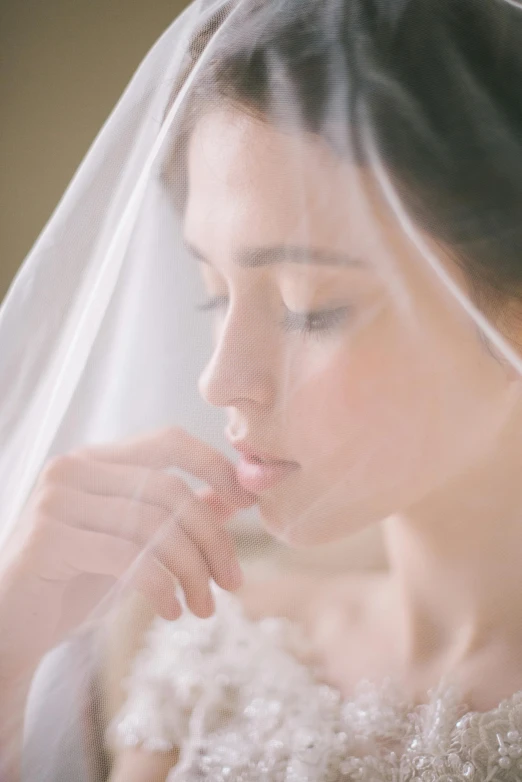 a young lady that is wearing a veil