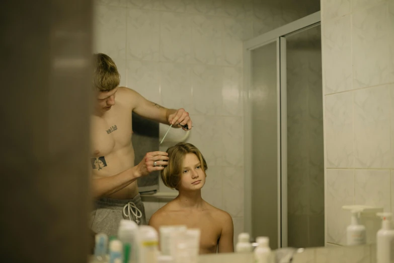 a man in a bathroom with a towel on his head