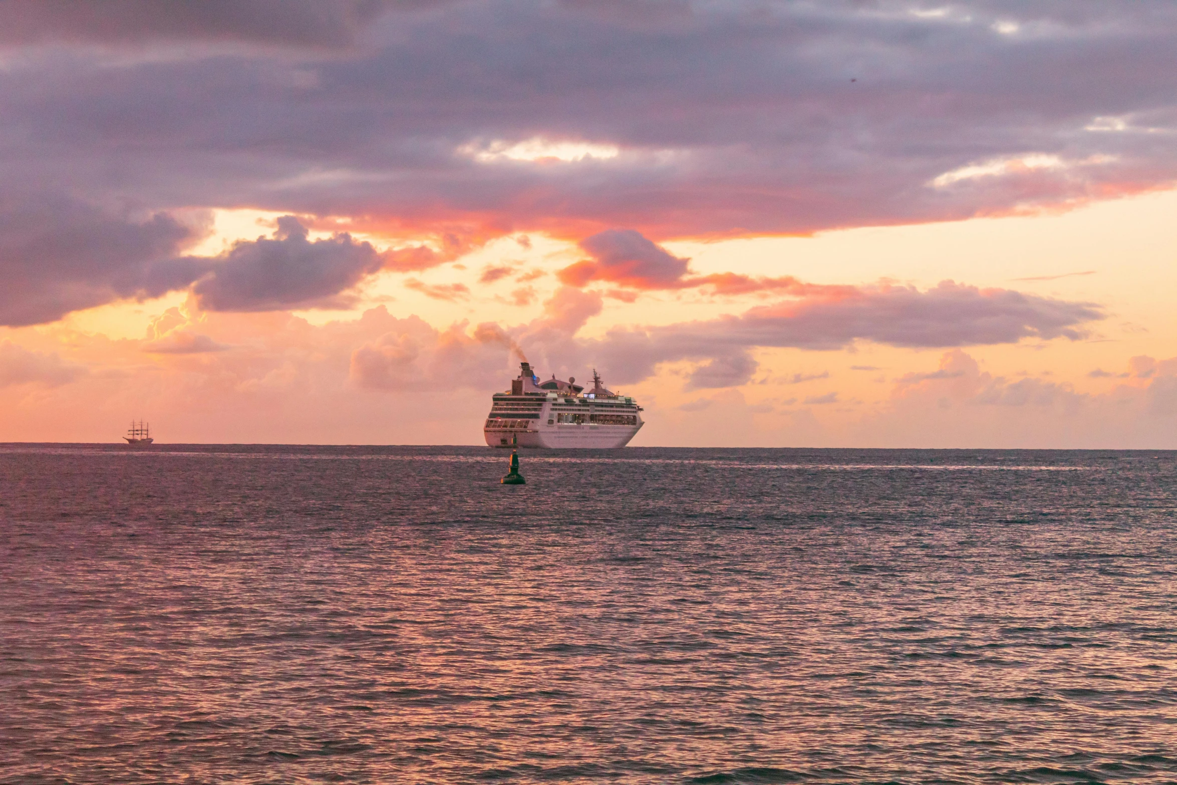 the cruise ship sailing across the open ocean